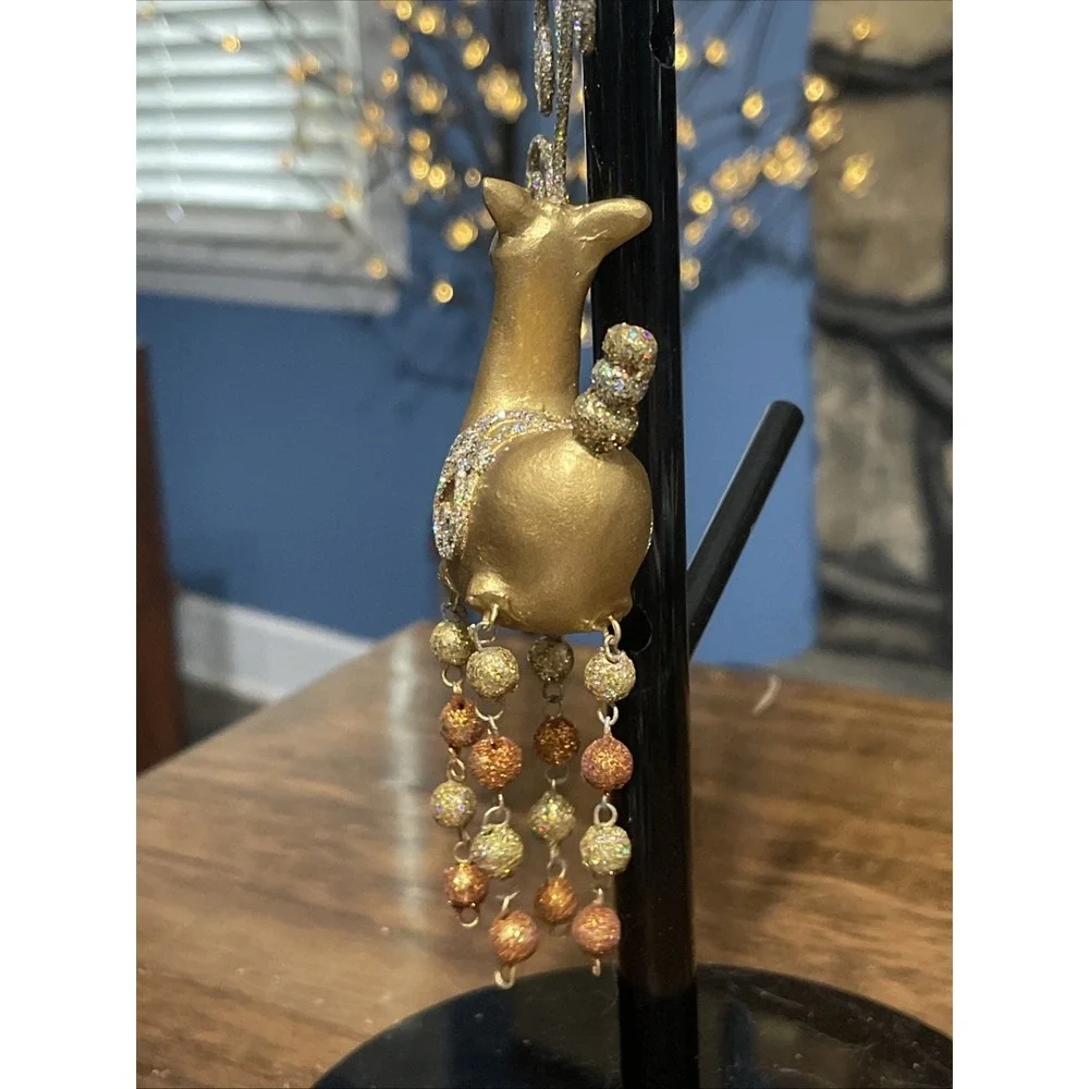 Pier 1 Reindeer Christmas ornament glittery gold style with beaded dangly legs